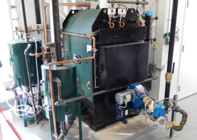 MPH 20 low pressure steam boiler, feed tank, blow down separator, and burner.