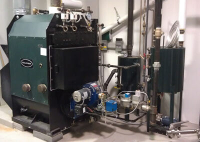 MPH 20 boiler with burner (blue) and to the right the blow down separator and feed tank.